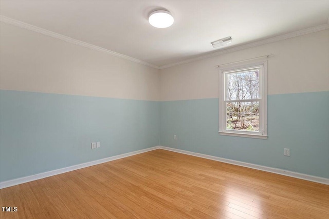 3418 Carriage Trl, Hillsborough, NC 27278 - spare room featuring light wood-style flooring, ornamental molding, and baseboards