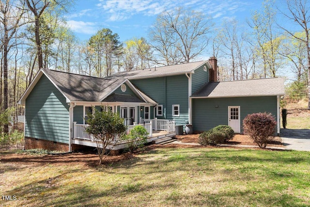 3418 Carriage Trl, Hillsborough, NC 27278 - rear view of house featuring a chimney, a lawn, and roof with shingles