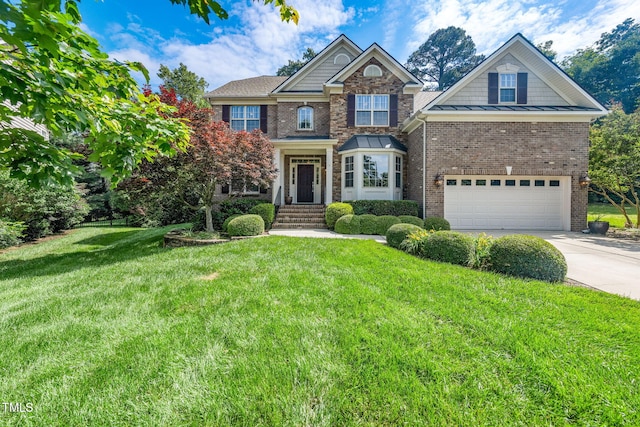 view of front of home with an attached garage, concrete driveway, a front lawn, and brick siding