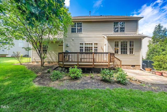 rear view of house featuring crawl space, a wooden deck, a yard, a patio, and cooling unit