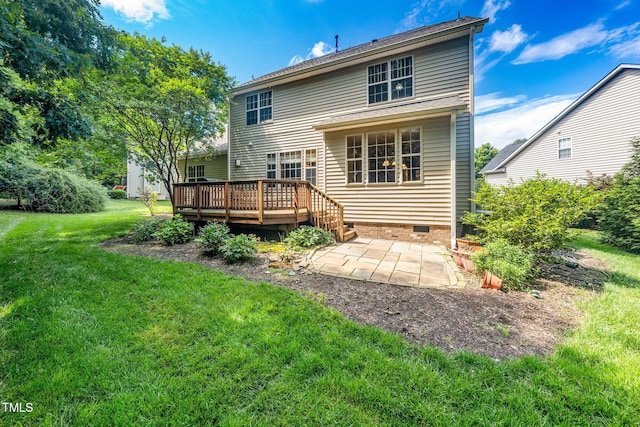 back of house featuring a patio, a wooden deck, a yard, and crawl space