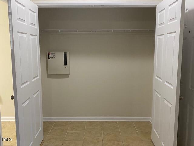 21 Suncrest Ct, Durham, NC 27703 - laundry area with baseboards and light tile patterned floors