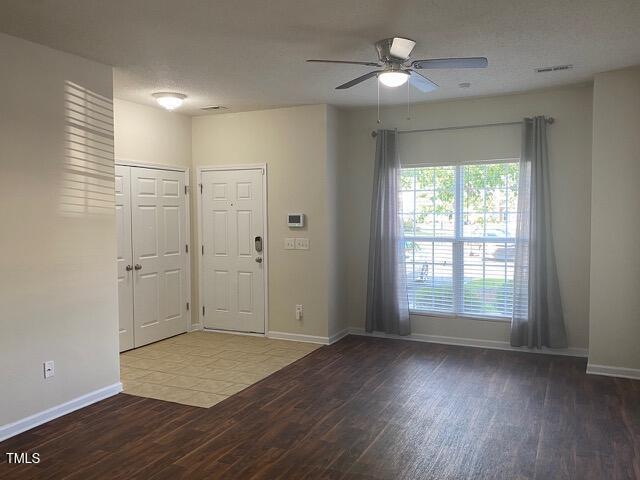 21 Suncrest Ct, Durham, NC 27703 - foyer featuring wood finished floors, a ceiling fan, and baseboards