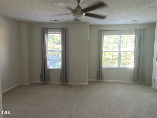 21 Suncrest Ct, Durham, NC 27703 - carpeted spare room with a ceiling fan, baseboards, and a textured ceiling
