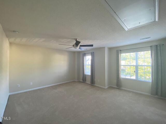 21 Suncrest Ct, Durham, NC 27703 - empty room with attic access, baseboards, ceiling fan, and light colored carpet