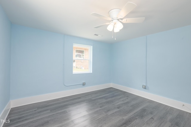 1917 Tucker St, Burlington, NC 27215 - empty room with dark wood finished floors, baseboards, and ceiling fan