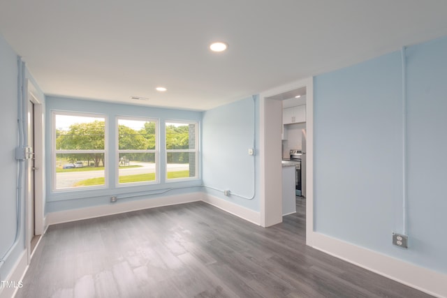 1917 Tucker St, Burlington, NC 27215 - empty room featuring baseboards, dark wood-type flooring, and recessed lighting