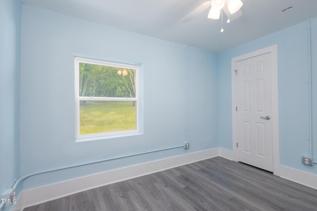 1917 Tucker St, Burlington, NC 27215 - empty room with dark wood-style floors, ceiling fan, and baseboards