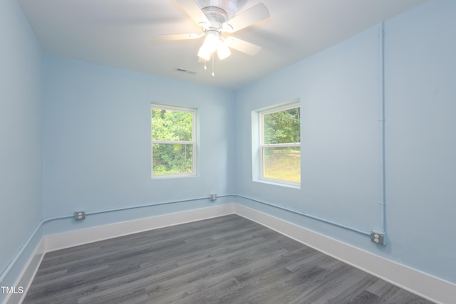 1917 Tucker St, Burlington, NC 27215 - unfurnished room featuring dark wood finished floors, baseboards, and ceiling fan