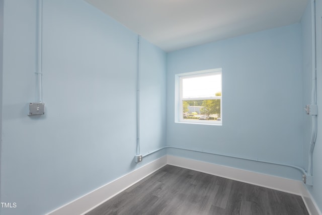 1917 Tucker St, Burlington, NC 27215 - unfurnished room with dark wood-style flooring and baseboards