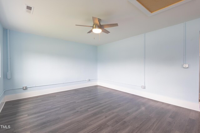 1917 Tucker St, Burlington, NC 27215 - empty room with baseboards, dark wood-style flooring, and a ceiling fan