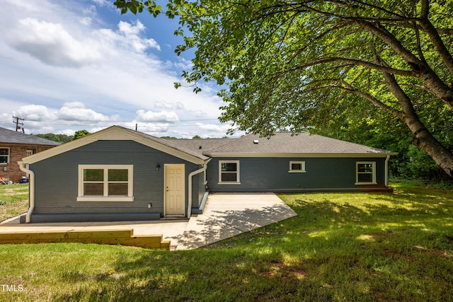 1917 Tucker St, Burlington, NC 27215 - rear view of house with a patio area, a yard, and brick siding