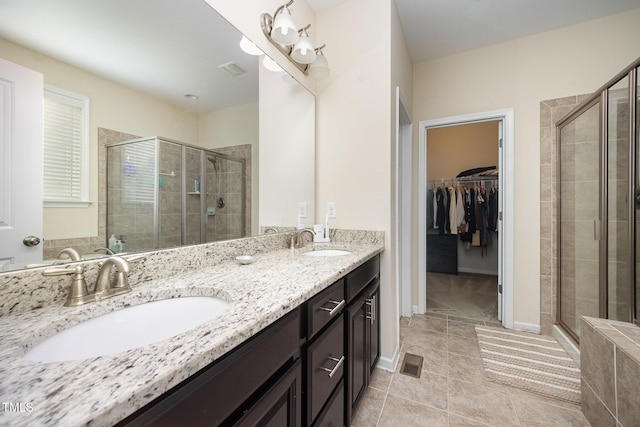 1201 Pleasant Falls Ct, Wake Forest, NC 27587 - full bath featuring a shower stall, double vanity, tile patterned flooring, and a walk in closet