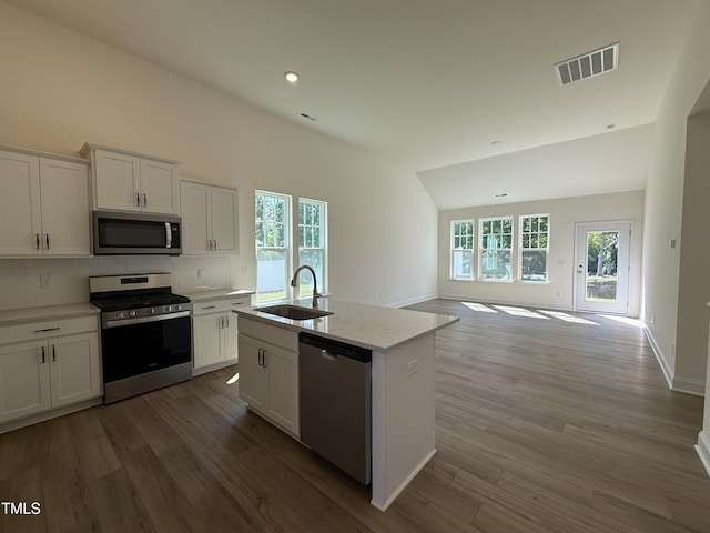 367 Whitley Ridge Dr, Clayton, NC 27527 - kitchen featuring stainless steel appliances, a sink, open floor plan, white cabinets, and backsplash