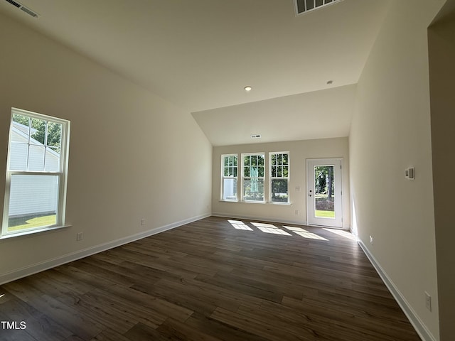 367 Whitley Ridge Dr, Clayton, NC 27527 - unfurnished living room with healthy amount of natural light, dark wood-type flooring, lofted ceiling, and baseboards