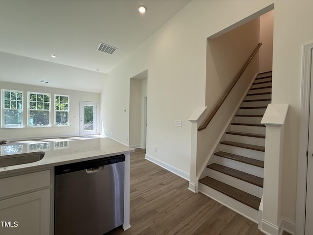367 Whitley Ridge Dr, Clayton, NC 27527 - kitchen featuring stainless steel dishwasher, wood finished floors, a sink, white cabinetry, and recessed lighting