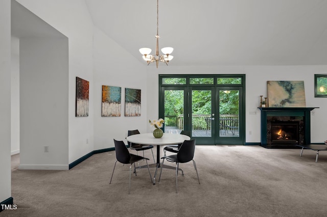 224 Crawford Rd, Hillsborough, NC 27278 - dining space with carpet floors, a chandelier, baseboards, a fireplace, and high vaulted ceiling