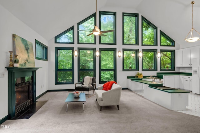 224 Crawford Rd, Hillsborough, NC 27278 - living area featuring high vaulted ceiling, ceiling fan, a fireplace, and light carpet