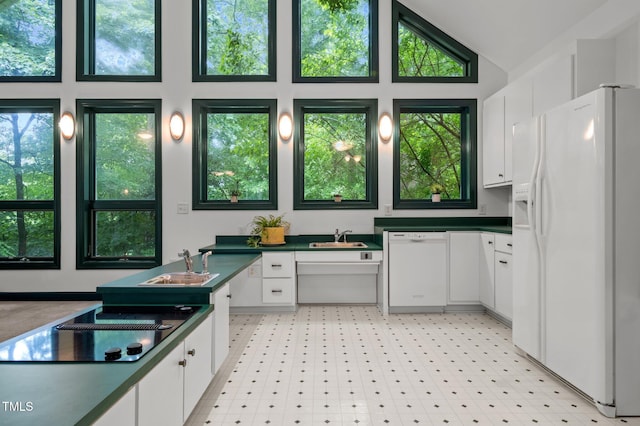 224 Crawford Rd, Hillsborough, NC 27278 - kitchen with white appliances, a sink, white cabinets, and high vaulted ceiling