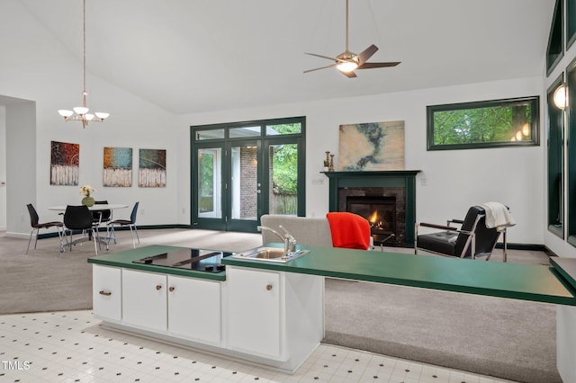 224 Crawford Rd, Hillsborough, NC 27278 - living area with a glass covered fireplace, plenty of natural light, a chandelier, a ceiling fan, and high vaulted ceiling