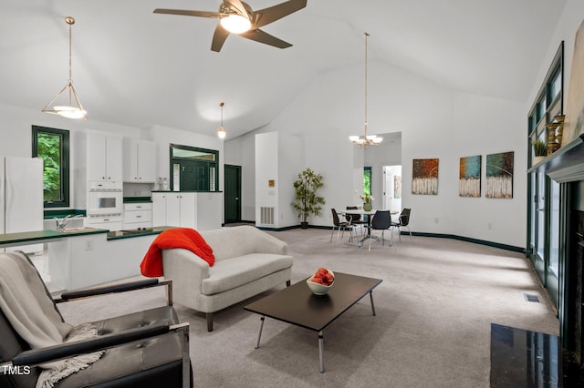 224 Crawford Rd, Hillsborough, NC 27278 - living room featuring high vaulted ceiling, a chandelier, plenty of natural light, light colored carpet, and ceiling fan