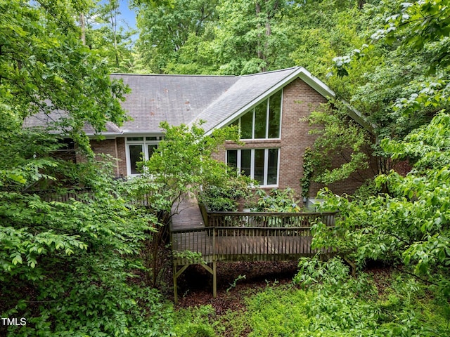 224 Crawford Rd, Hillsborough, NC 27278 - rear view of property with a wooden deck, roof with shingles, and brick siding