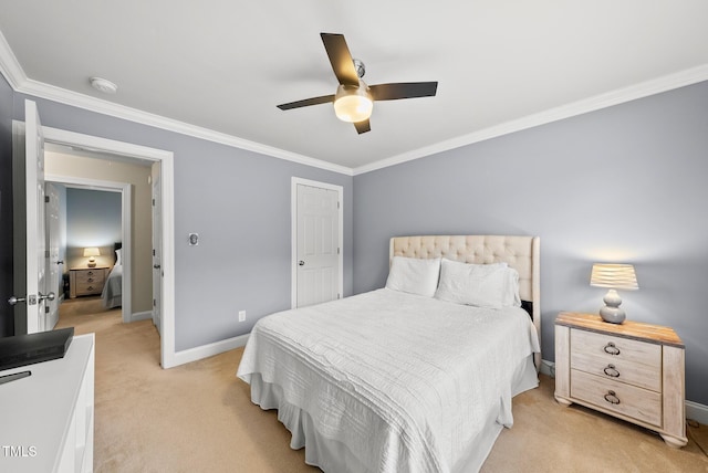 bedroom with ornamental molding, baseboards, light colored carpet, and a ceiling fan