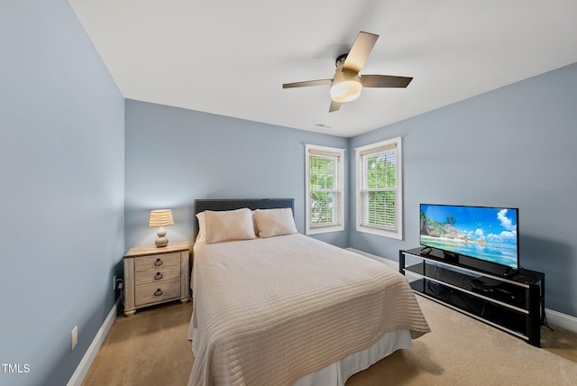 bedroom featuring carpet floors, baseboards, and ceiling fan