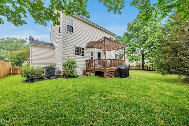 back of property with a pergola, a wooden deck, and central AC unit