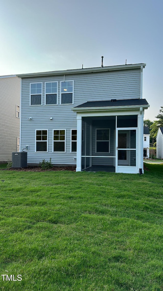3112 Star Gazing Ln, Durham, NC 27703 - rear view of house featuring a yard, a sunroom, and cooling unit