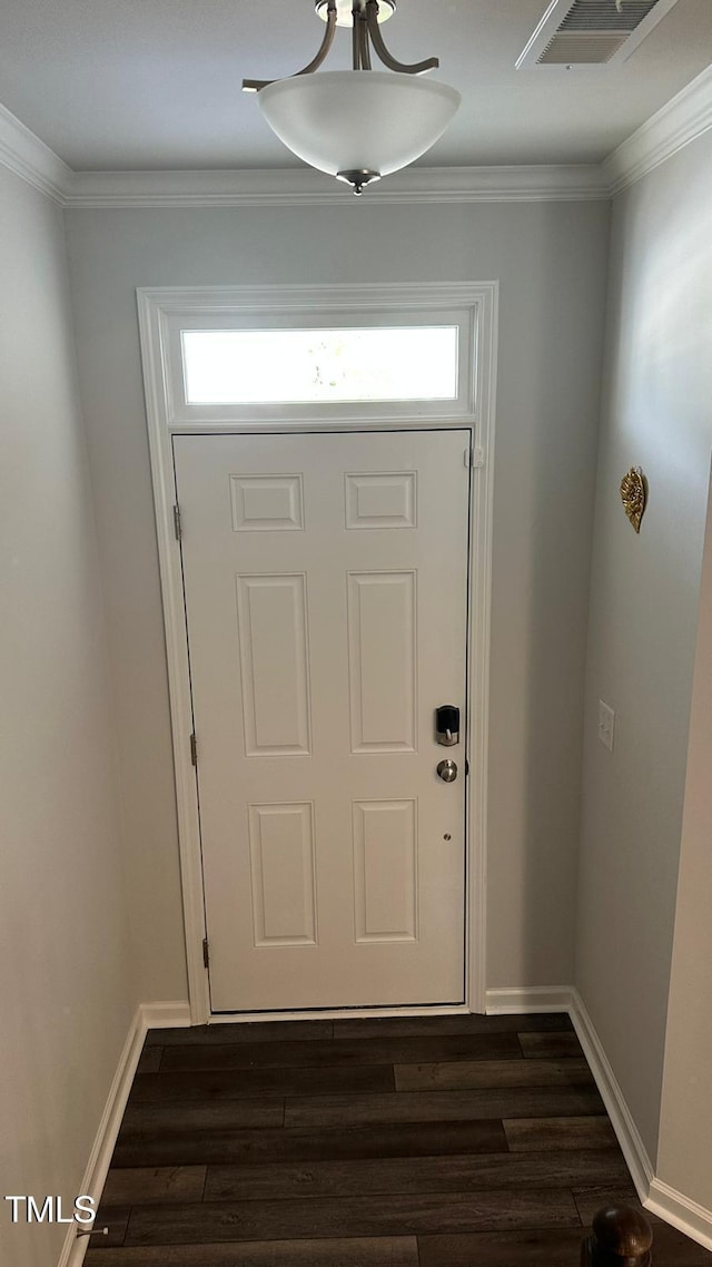 3112 Star Gazing Ln, Durham, NC 27703 - doorway featuring dark wood finished floors, crown molding, and baseboards
