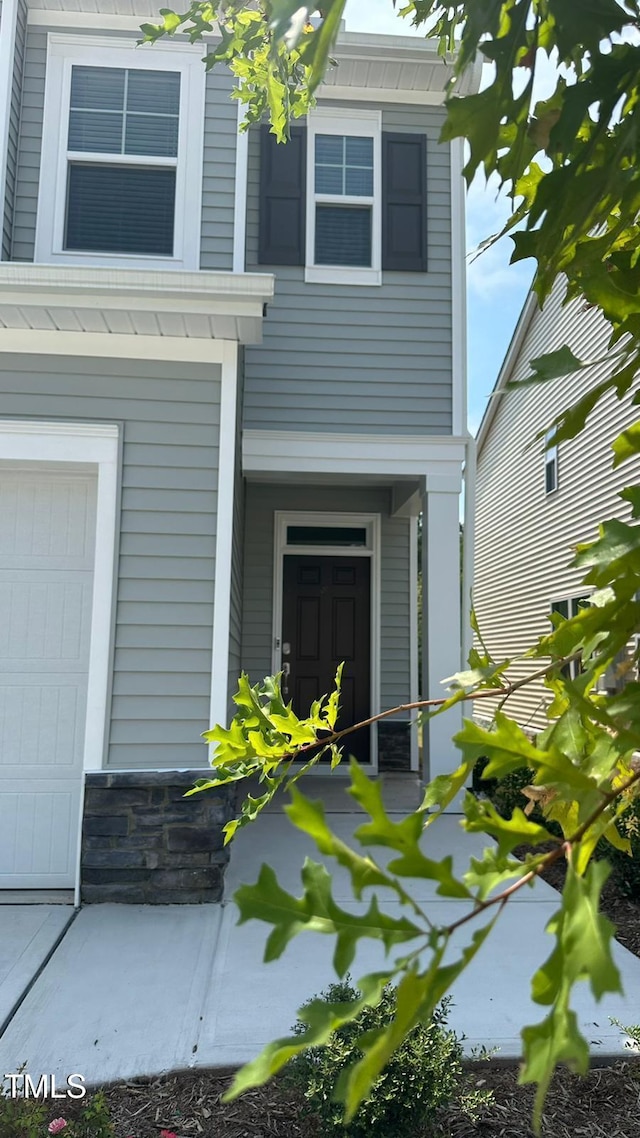 3112 Star Gazing Ln, Durham, NC 27703 - doorway to property with an attached garage
