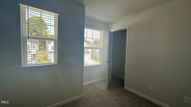 3112 Star Gazing Ln, Durham, NC 27703 - unfurnished bedroom with baseboards, a closet, and carpet flooring