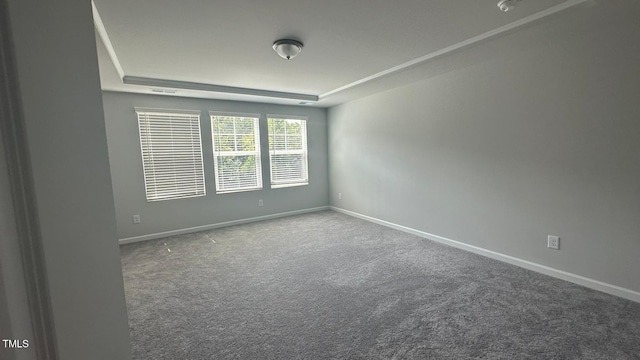 3112 Star Gazing Ln, Durham, NC 27703 - carpeted spare room featuring a tray ceiling and baseboards
