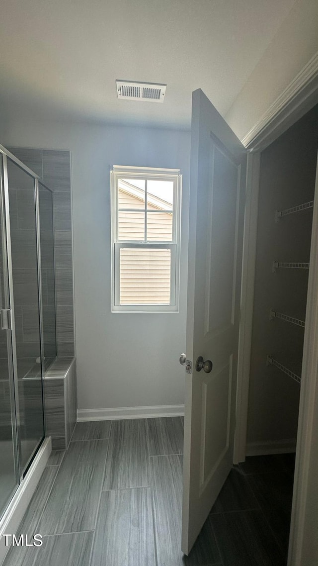 3112 Star Gazing Ln, Durham, NC 27703 - bathroom featuring a stall shower and baseboards