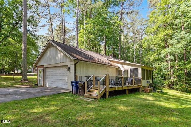 view of front of property with a front yard, a sunroom, a chimney, and a deck
