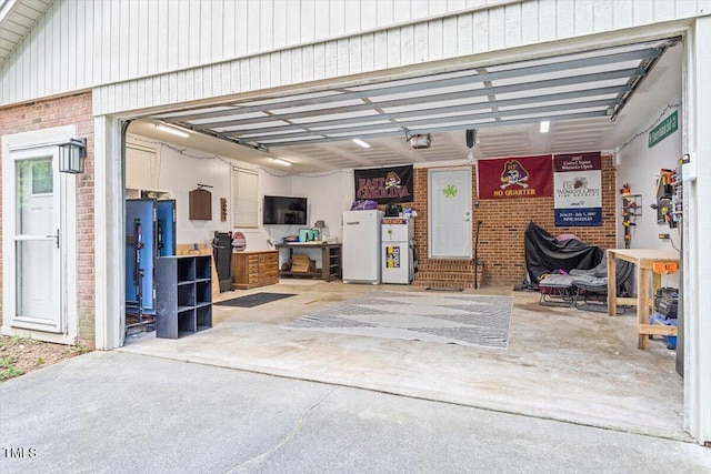 garage with freestanding refrigerator