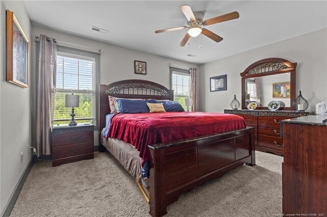 2677 Cypress Lakes Rd, Hope Mills, NC 28348 - bedroom featuring light carpet, ceiling fan, and baseboards