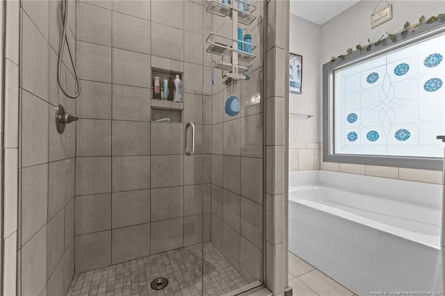 2677 Cypress Lakes Rd, Hope Mills, NC 28348 - bathroom featuring a shower stall, tile patterned flooring, and a garden tub