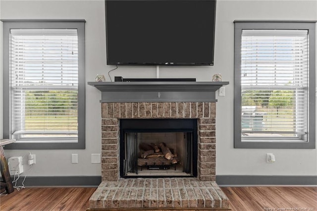 2677 Cypress Lakes Rd, Hope Mills, NC 28348 - detailed view of wood finished floors and a brick fireplace