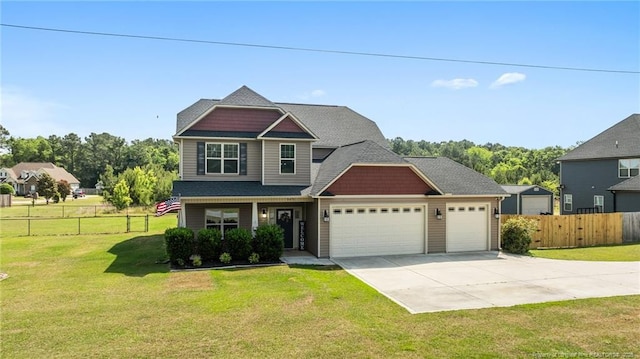 craftsman house with driveway and an attached garage