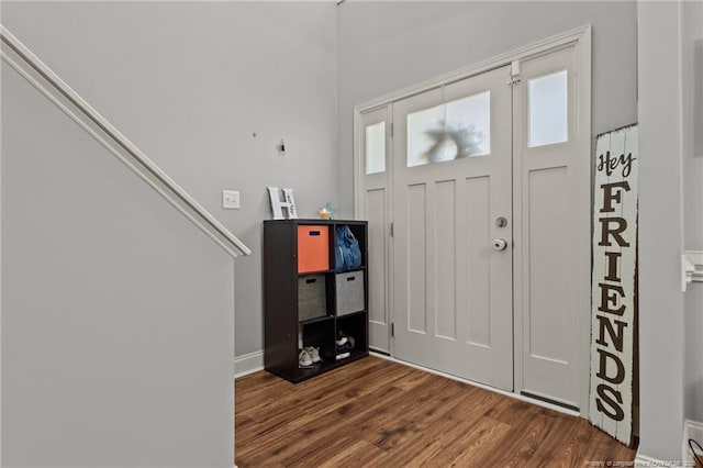 entrance foyer featuring dark wood finished floors