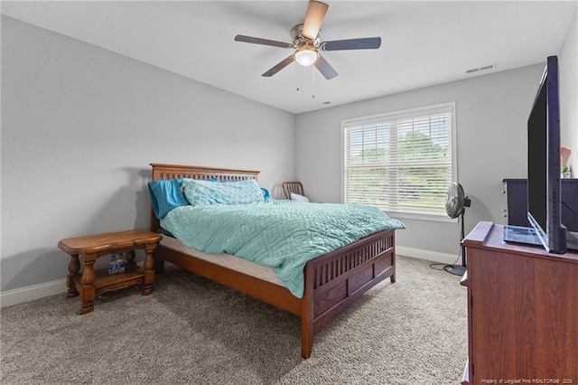 bedroom featuring carpet, baseboards, and ceiling fan