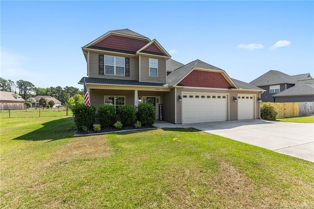 craftsman inspired home featuring an attached garage and driveway