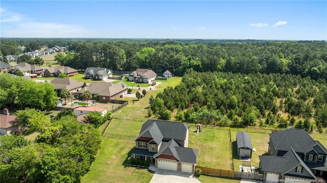 aerial view of residential area with a heavily wooded area
