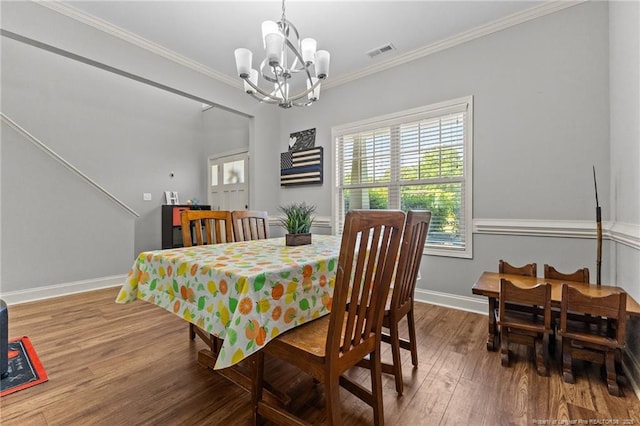 2671 Cypress Lakes Rd, Hope Mills, NC 28348 - dining area featuring a chandelier, wood finished floors, ornamental molding, and baseboards
