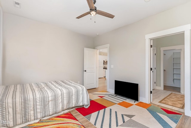 303 Godwin St, Selma, NC 27576 - bedroom featuring wood finished floors and ceiling fan