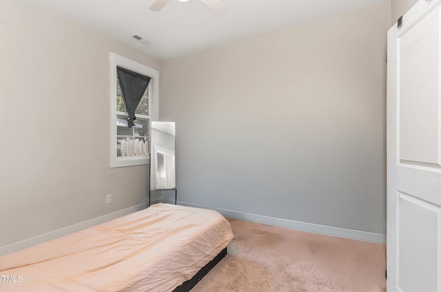 303 Godwin St, Selma, NC 27576 - carpeted bedroom featuring baseboards and ceiling fan