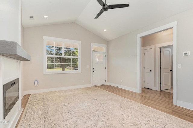 303 Godwin St, Selma, NC 27576 - unfurnished living room featuring a ceiling fan, wood finished floors, baseboards, lofted ceiling, and recessed lighting