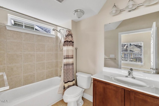 bathroom with toilet, healthy amount of natural light, shower / bath combination with curtain, and vanity